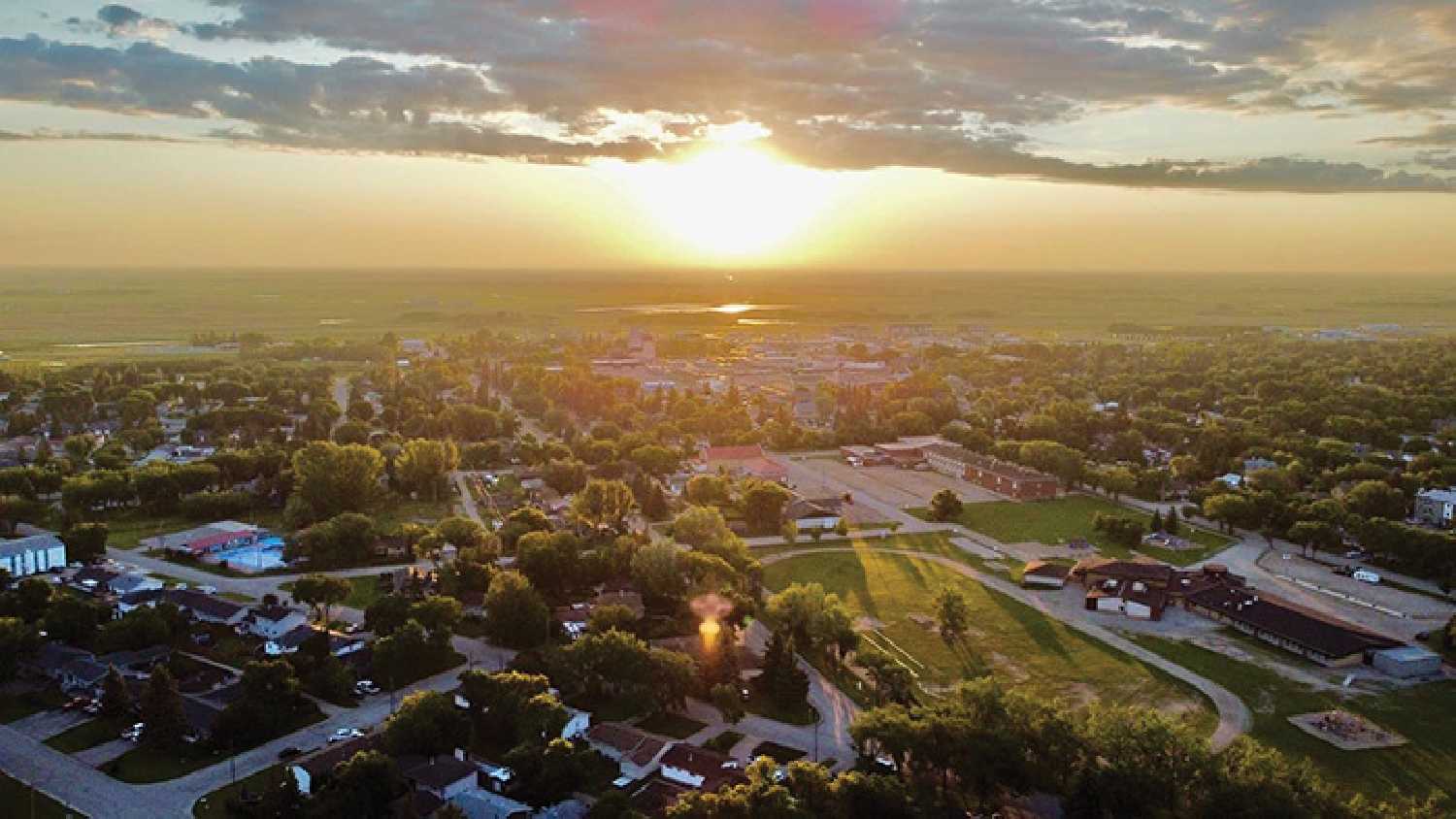 The Town of Moosomin will be participating in this year’s Communities in Bloom contest. The competition focuses on the quality of municipalities’ green spaces, diversity and originality of its landscape, as well community projects that highlight environmental awareness and heritage within the area. <b>Photo:</b> Editor Kevin Weedmark took a drone shot of a sunrise in Moosomin last summer.